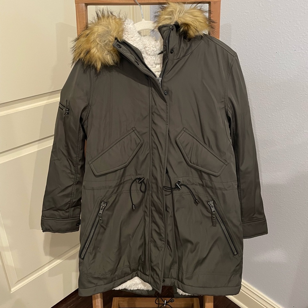 green fur lined coat